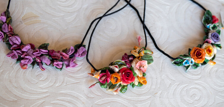necklace made in the form of a flower motif from materials of various colors