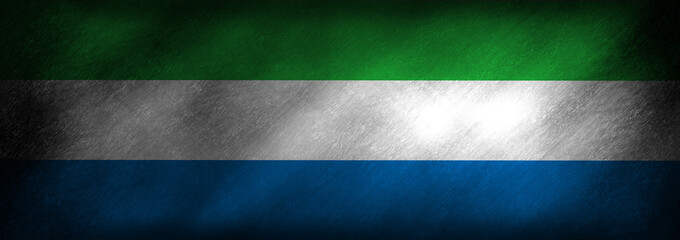 The flag of Sierra Leone on a retro background