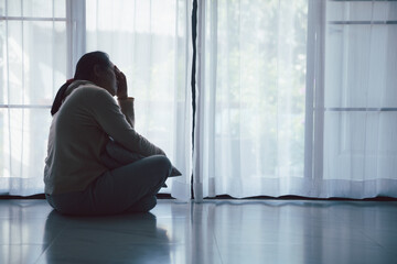 Schizophrenia with lonely and sad in mental health depression concept. Depressed woman sitting...
