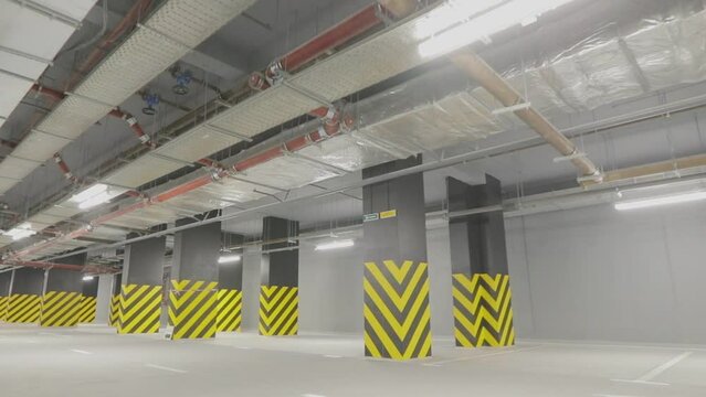 Empty underground parking. Modern empty underground parking. Bright modern car park