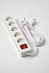 White extension cord for five sockets witn illuminated power circuit breaker