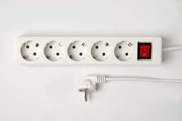 White extension cord for five sockets witn illuminated power circuit breaker