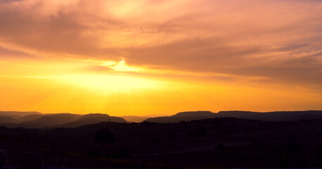 Obraz premium Beautiful view of the sunset over the mountains.