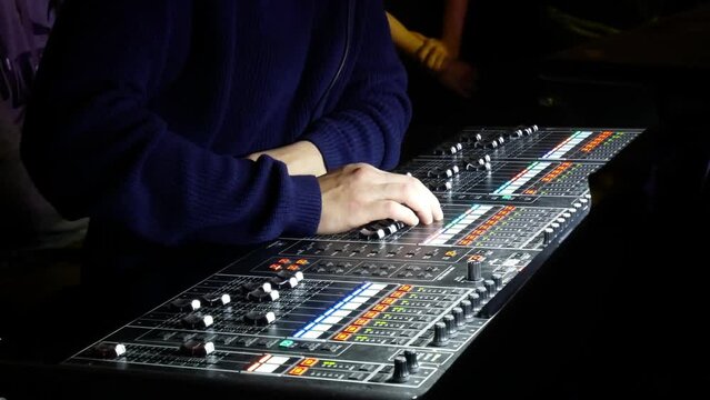 Man using remote sound equipment closeup, Mixing console for music and sound producer. Sound controller. Director's remote