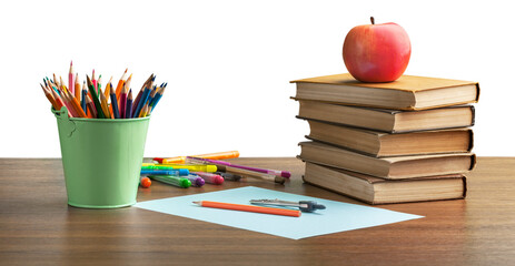 A school desk with stack of books and stationery