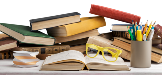 Open book and stack of old books with glasses