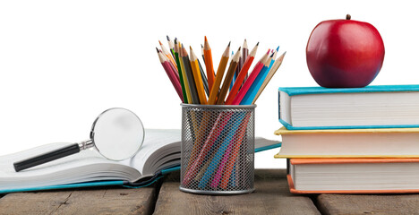Stack school books with colorful pencils on a desk