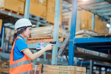Portrait asian engineer in helmets checking order on computer goods and supplies on shelves with goods background in warehouse.logistic  business export ,Warehouse worker checking packages on store