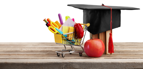 Graduation hat with colorful supplies on desk