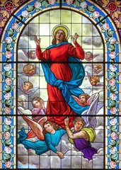 Gartenposter DOMODOSSOLA, ITALY - JULY 19, 2022: The Assumption of Virgin Mary on the stained glass in church Chiesa dei Santi Gervasio e Protasio by Luigi Fontana from 19. cent. © Renáta Sedmáková