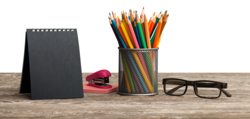 The calendar and colored pencil in a jar on the school table