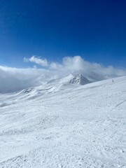 Above the clouds on Elbrus Ski resort Elbrus downhill skiing. Mountains of white snow