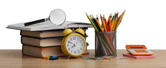 Stacked books with colorful pencils on the desk