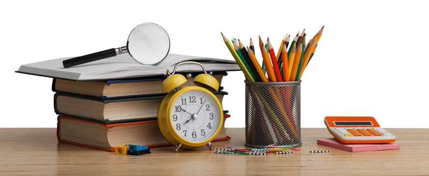 Stacked books with colorful pencils on the desk
