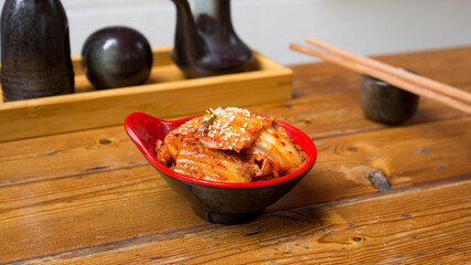 Bowl with kimchi salad. Kimchi is a Korean dish made from a fermented preparation whose basic ingredient is Asian cabbage or Brassica pekinensis cabbage.