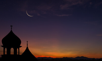 Crescent moon over dome mosques on dusk sky in the evening on twilight religion of Islamic and free...
