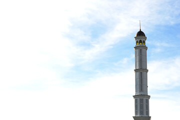 Great Mujahidin mosque minaret against a blue sky background