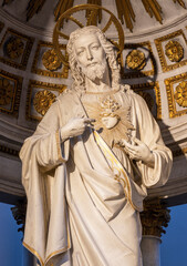 BELLANO, ITALY - JULY 20, 2022: The carved polychrome statue of Heart of Jesus from main altar of...