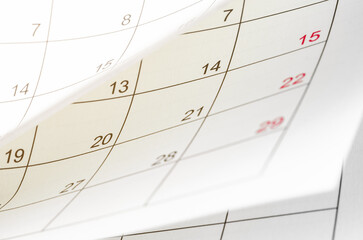 A Calendar page flipping sheet close up blur background business schedule planning appointment...