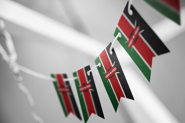 A garland of Kenya national flags on an abstract blurred background