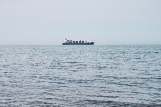 Cargo ship floating on rippling sea