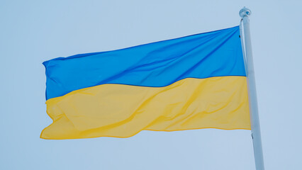 Ukrainian Flag close up view with sky background