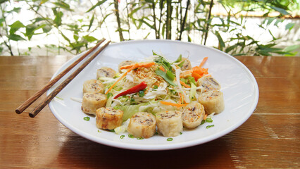 Fried Vietnamese nem stuffed with meat. Chả giò, also known as nem rán, is a popular dish in Vietnamese cuisine that is usually served as an appetizer.