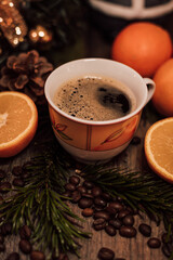 Christmas composition cup of coffee, fruit, candle on a wooden table