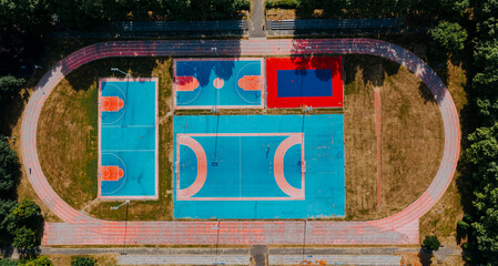 Aerial view of sport playground between the buildings - 555435674