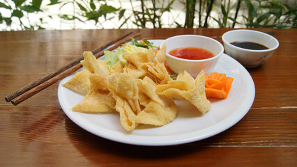 Fried wan tan dumplings. Won ton is a very thin and stuffed dough that is very common in Chinese cuisine.