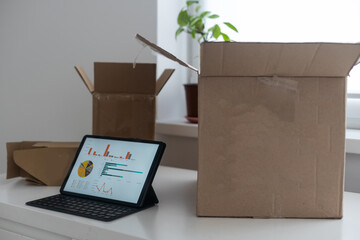 tablet computers. Online products to prepare product boxes with graph business diagram, idea, creativity, and finance strategy concept.