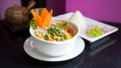 Vegetarian Asian soup. Traditional North Asian recipe with spices such as curry and herbs such as coriander.