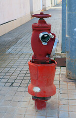 Red fire hydrant faucet on the street close-up, fire fighting, fire safety, Spain