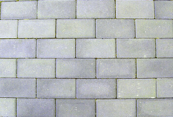 Texture of gray rectangular stone tiles, asphalt color background, closeup macro