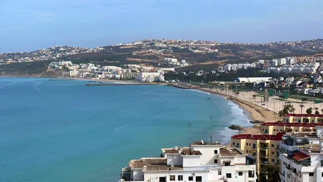Aerial timelapse of a Mediterranean beach with buildings nearby