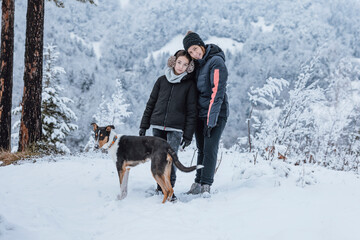 Mother and daughter spend their time together with the dog.