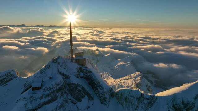 Aerial View of the Mountain Seantis in the Swiss Alps, Switzerland. Santis Weather Station, View Platform at sunset.