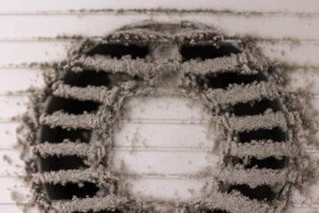 Very dirty and dusty white plastic air vent. The ventilation shaft in the apartment. Dirty air...