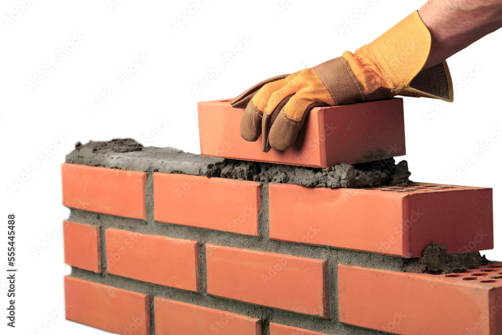 Wall mural Man worker installing brick masonry wall with a trowel