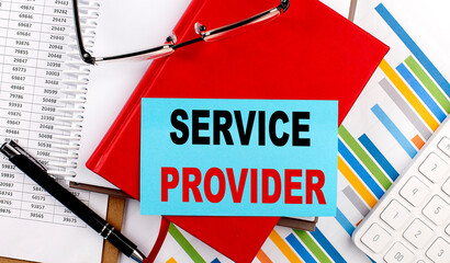SERVICE PROVIDER text on sticky on red notebook on chart background
