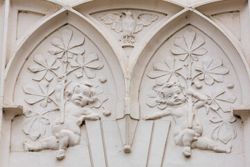 Ancient bas-reliefs in the architecture of the city. Historical and cultural heritage. Background with selective focus