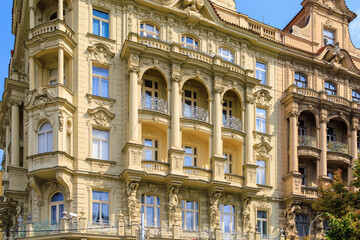 Facade of the house of classical European architecture of the old cozy tourist city. Background