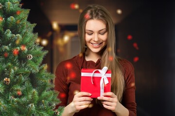 Happy young woman with gift box
