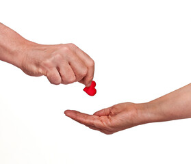 Man gives red heart to woman, isolated on white background and copy space. Concept of love, passion, romance, romantic, valentine, organ donation.