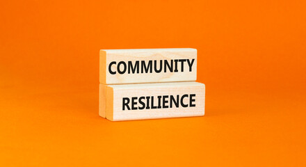 Community resilience symbol. Concept word Community resilience typed on wooden blocks. Beautiful orange table orange background. Business and community resilience concept. Copy space.
