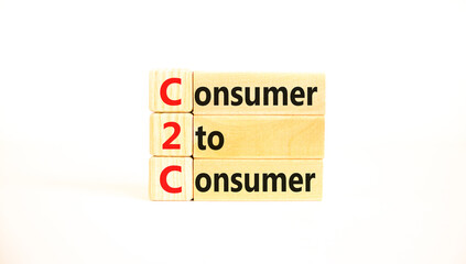 C2C consumer to consumer symbol. Concept words C2C consumer to consumer on wooden blocks on a beautiful white table white background. Business and C2C consumer to consumer concept. Copy space.
