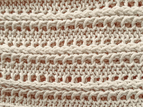 Handmade knitted background with detail woven threads.