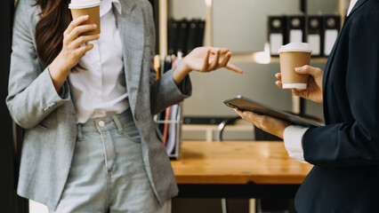 Businessman and team analyzing financial statement Finance task. with smart phone and laptop and tablet. Wealth management concept