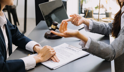 Male lawyer working with contract papers and wooden gavel on tabel in courtroom. justice and law ,attorney, court judge, concept.