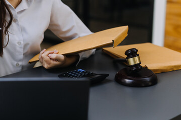 Male lawyer working with contract papers and wooden gavel on tabel in courtroom. justice and law ,attorney, court judge, concept.
